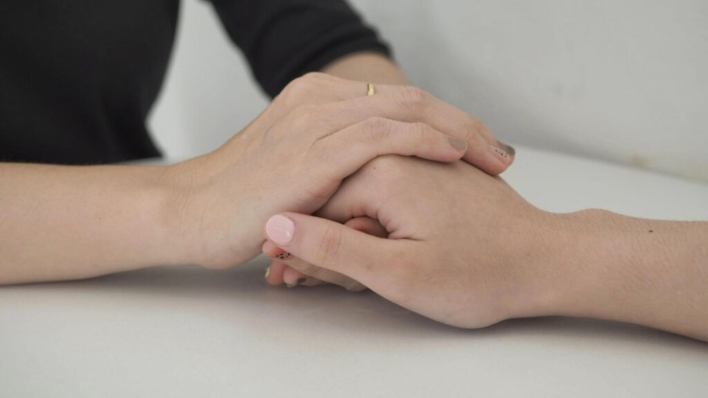 caring hands holding in home care for elderly 2023